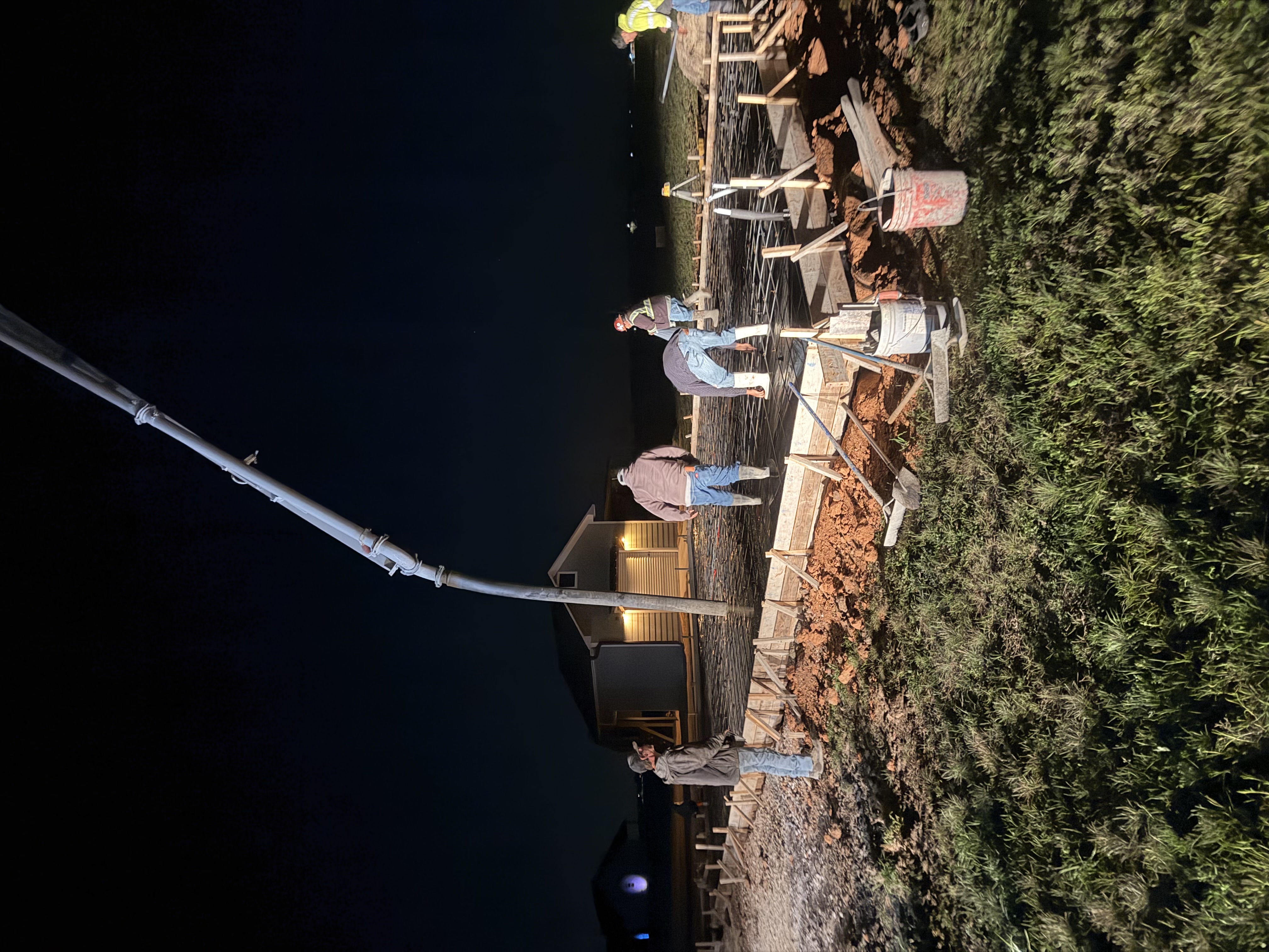 Night concrete pour on a residential job site — APC crew in Central Texas