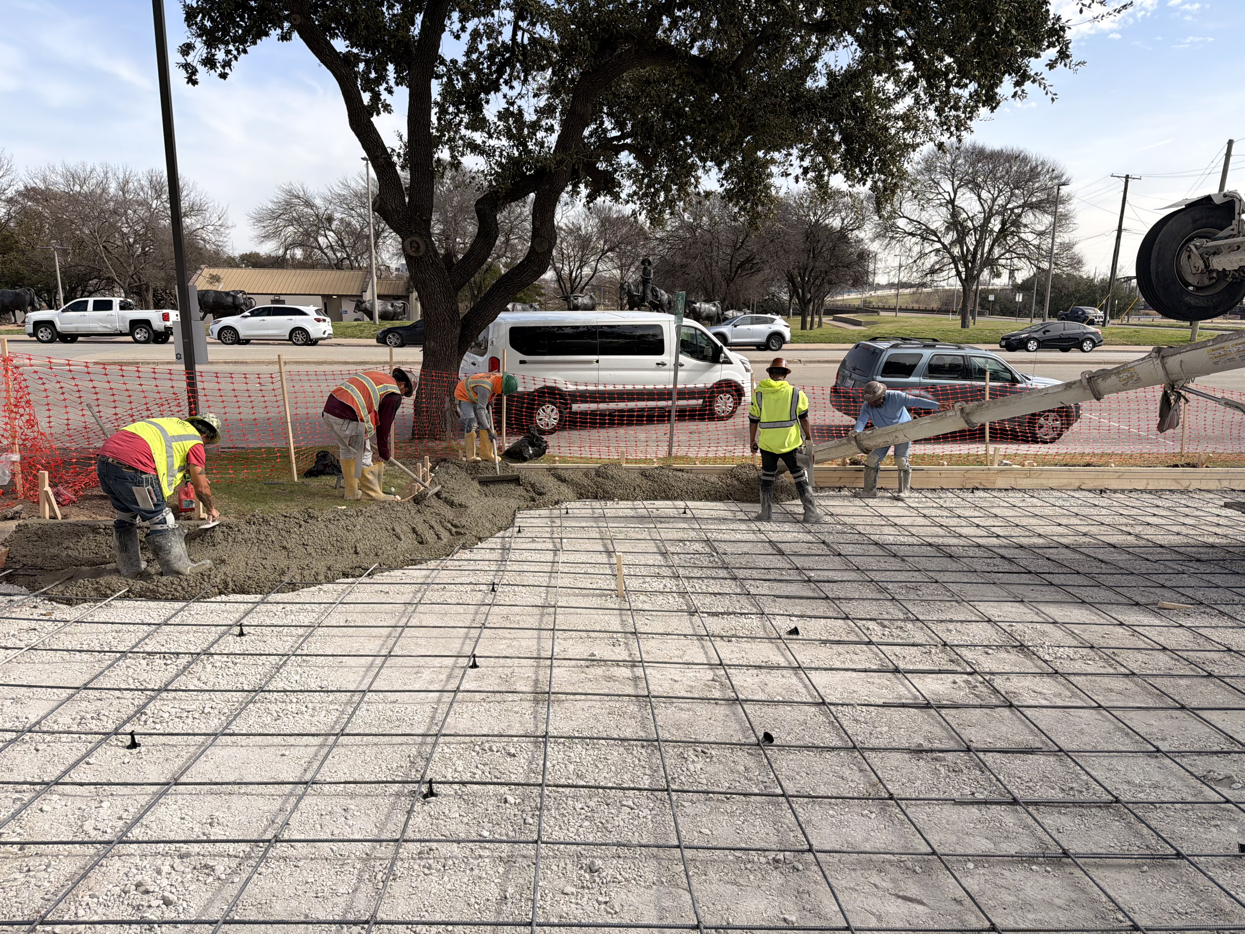 APC crew pouring and finishing a commercial concrete slab in Central Texas
