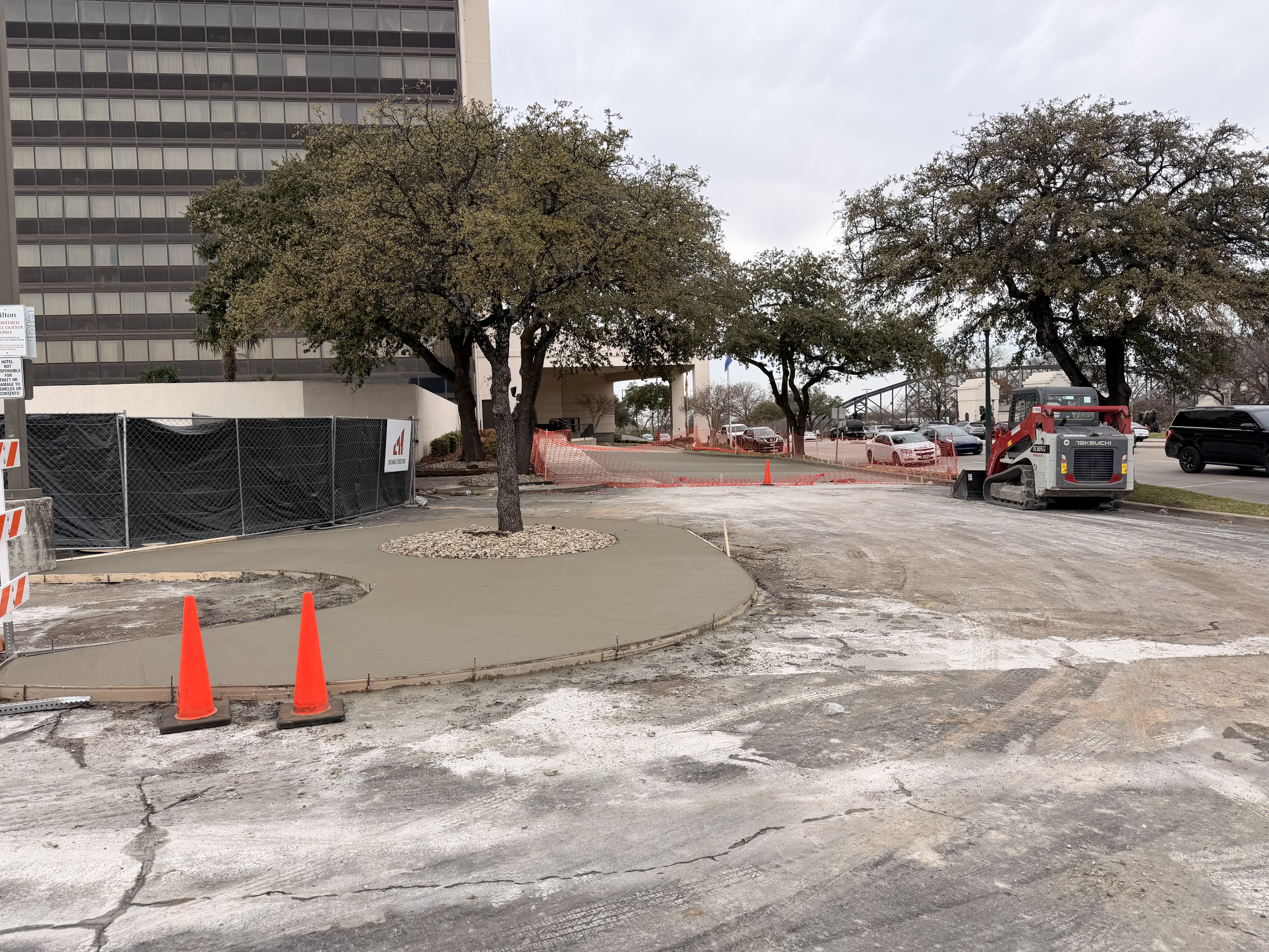 APC crew pouring and finishing a commercial concrete island at a hotel property