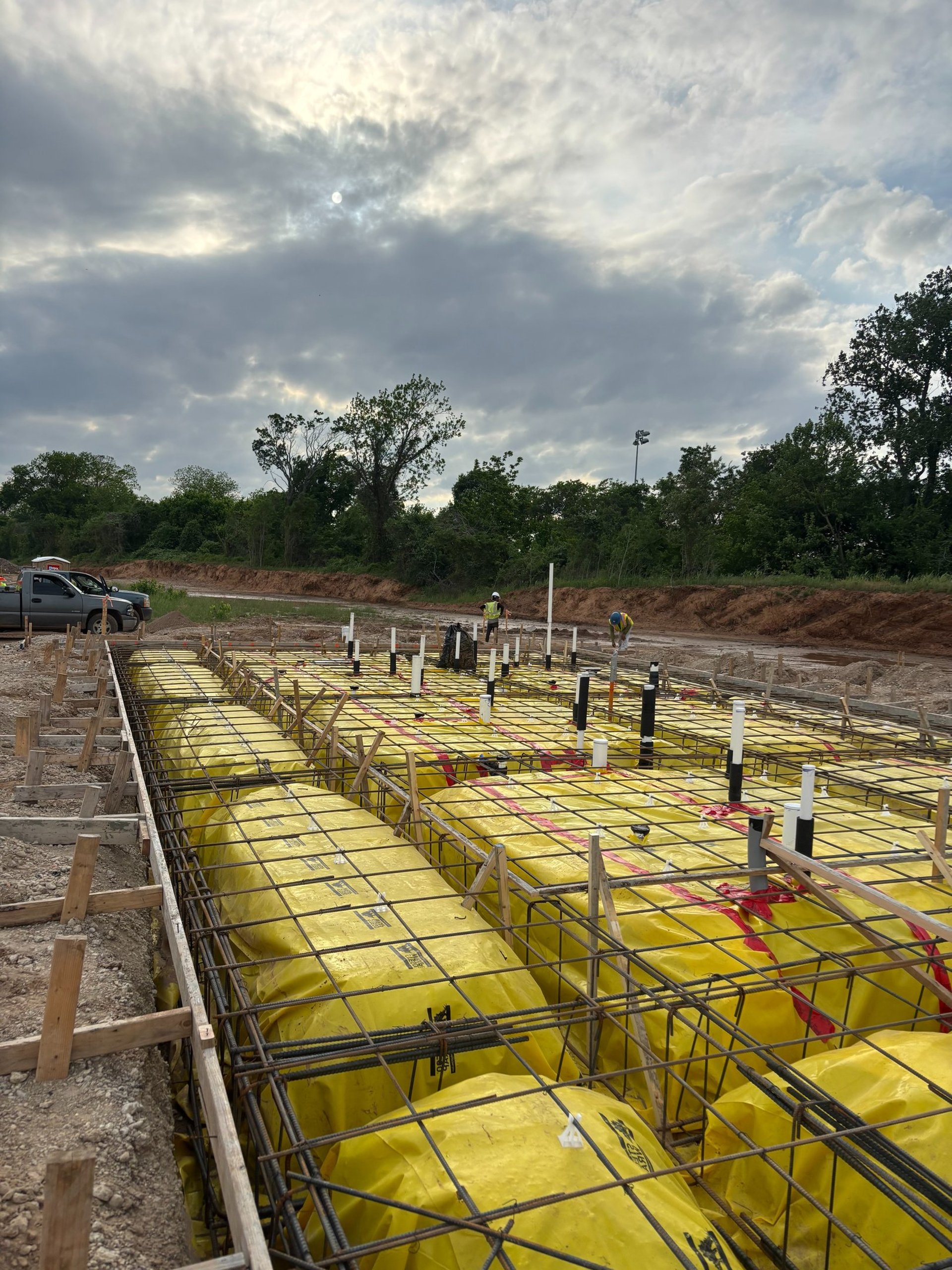 Night concrete pour in progress on a large APC job site in Central Texas